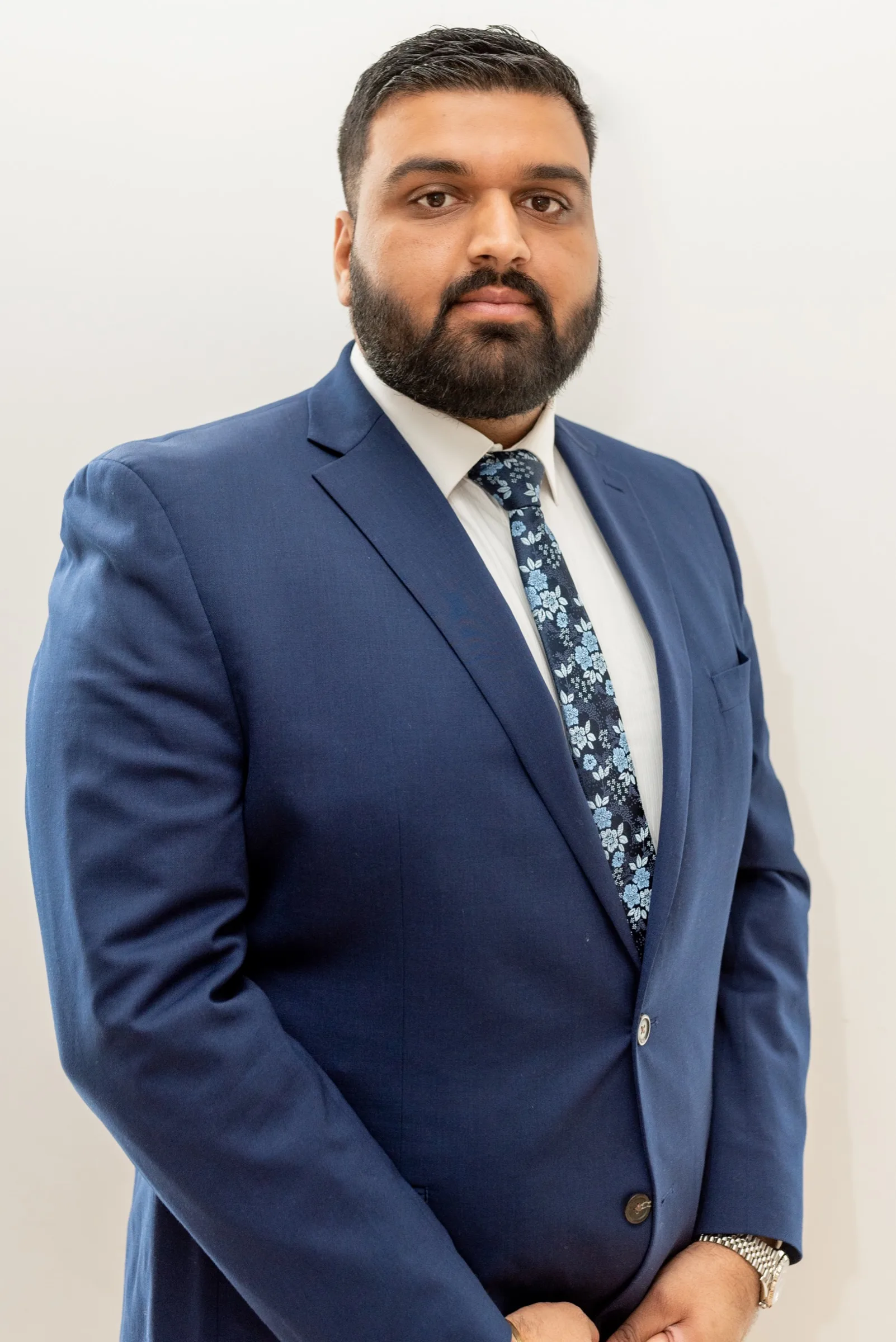 Puneet Mann in a navy suit